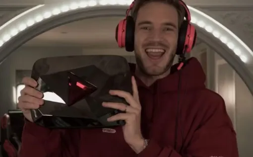 PewDiePie holding the YouTube Diamond Play Button award